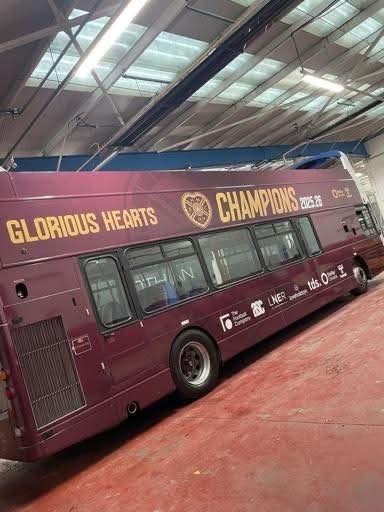 What goes beep, beep, beep, beep, beep? The Hearts open top  Champions bus reversing back into garage.