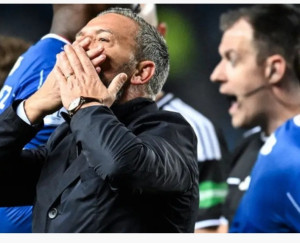 Is the guy in black wearing blue? And what's he shouting about?